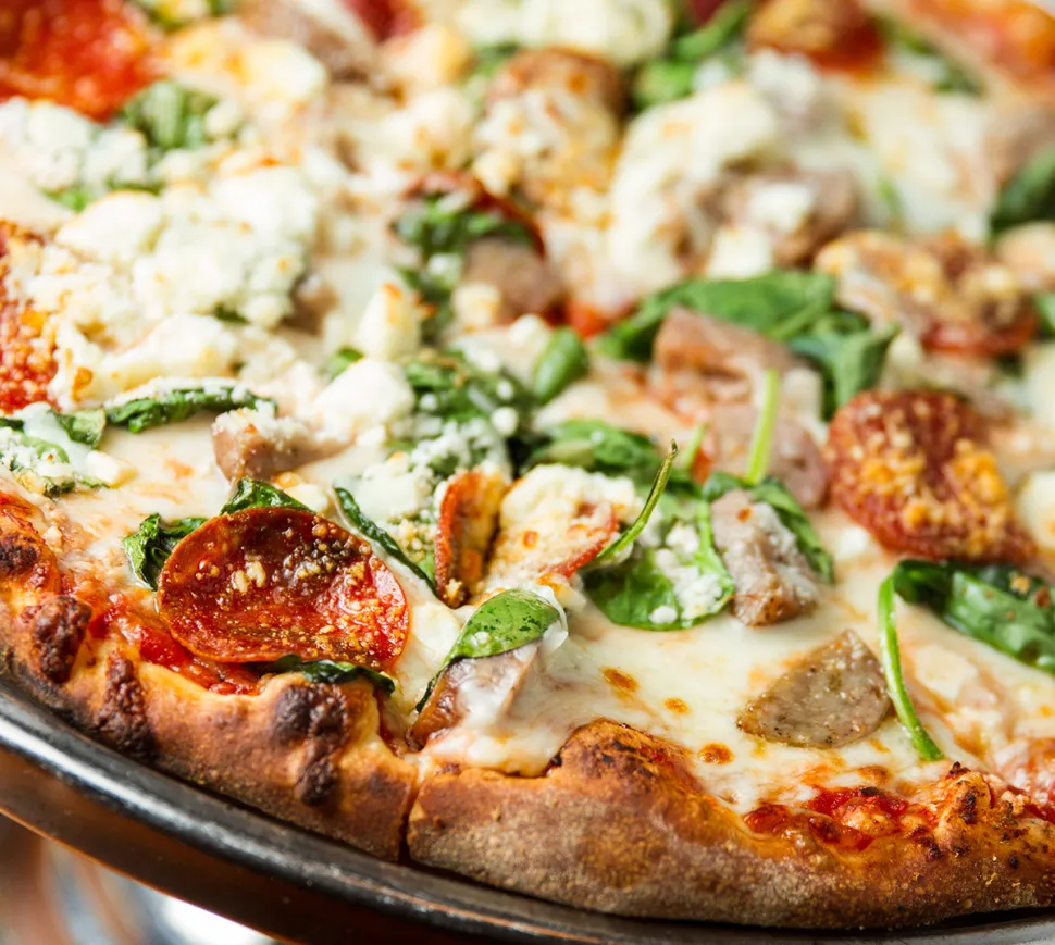 Fratello’s Italian Grille signature dishes Wood-Fired Brick Oven Pizza, Baked Stuffed Haddock, Steakhouse Tips, Italian Pie